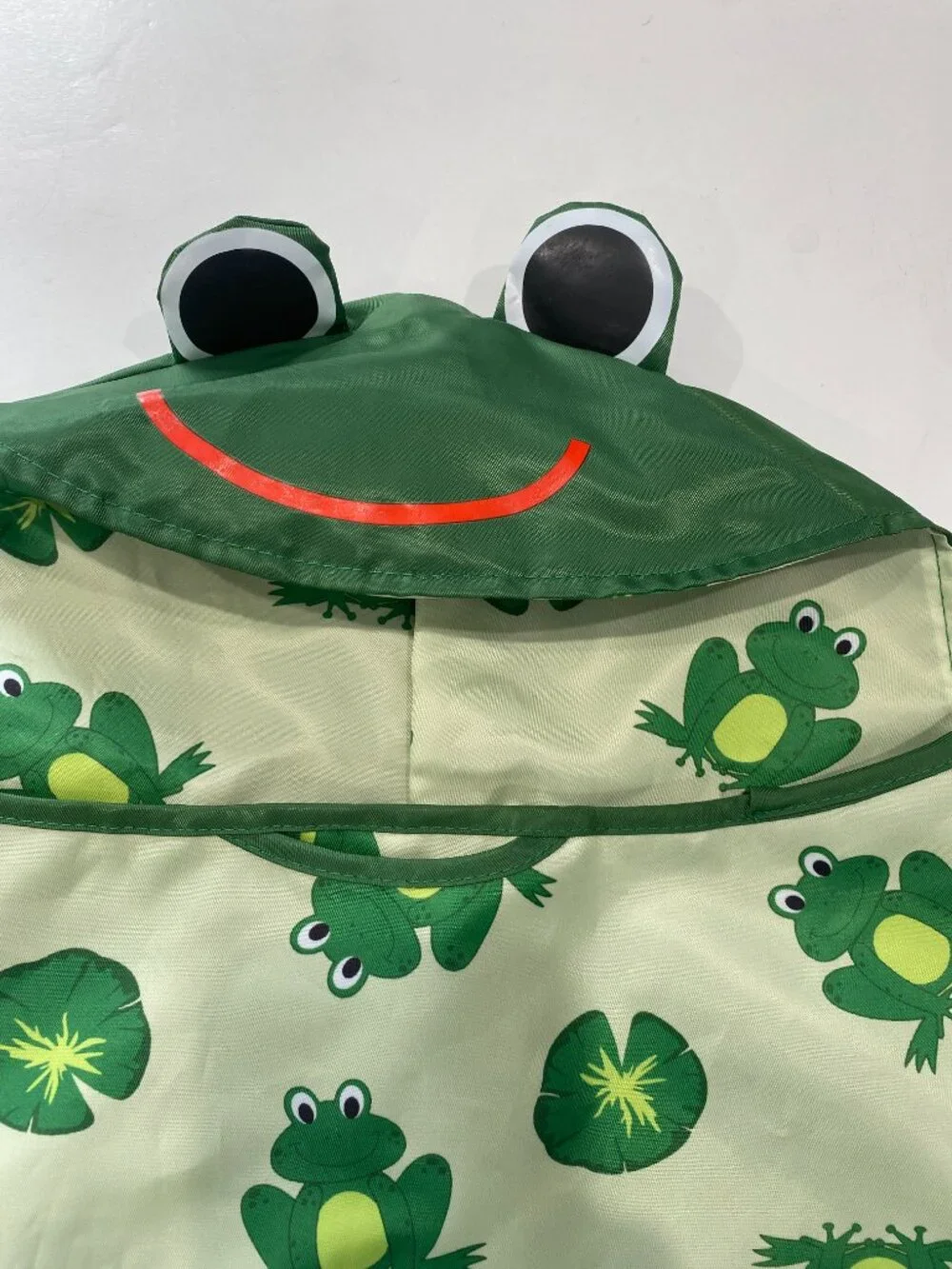 Frog NWOT various sizes dog raincoat with hood and reflective strip.